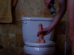 Soccer Mom with big boobs ride a Dildo on Toilet